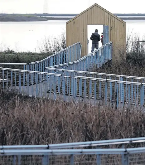  ?? NHAT V. MEYER/STAFF ARCHIVES ?? Mysterious yellow gates beguile visitors at Alviso Marina County Park.