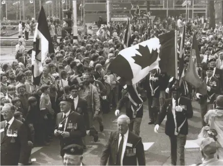  ??  ?? Canadian veterans are honoured every five years with a Thank You Canada parade in Apeldoorn, the Netherland­s. Canadian veterans ride in a motorcade of old army vehicles in a re-enactment of the town’s liberation in 1945 when Canadian and other Allied forces took back Holland.