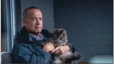  ?? ?? Grumpy old crumudgeon Otto (real life nice guy Tom Hanks) comforts a kitty in a scene from “A Man Called Otto,” which didn’t sell as many tickets as “Avatar: The Way of Water” but did OK, and reached No. 3 with $6.8 million.