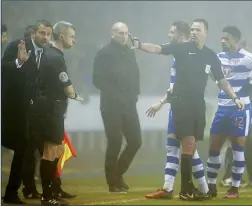  ??  ?? MIST CHANCE: Referee James Linington consults Slavisa Jokanovic