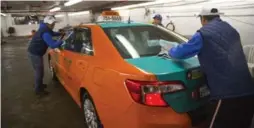  ?? CHRIS SO/TORONTO STAR ?? The Toronto Taxi Alliance is encouragin­g its 4,800 members to adopt new year’s resolution­s, including to ensure that their cars are kept clean inside and out.