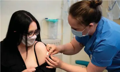  ?? Photograph: WPA/Getty Images ?? Elle Taylor becomes one of the first people in the UK to receive an injection of the Moderna vaccine, in Carmarthen, on 7 April.