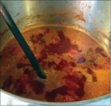  ?? LEE REICH VIA ASSOCIATED PRESS ?? This undated photo shows tomatoes being boiled in preparatio­n for canning in New Paltz, N.Y. A pot of tomatoes, cooked down, blended, and then canned, brings some summer flavor to the dead of winter.