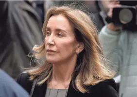  ?? STEVEN SENNE/AP ?? Felicity Huffman arrives at federal court Monday in Boston where she pleaded guilty in a nationwide college admissions bribery scandal.