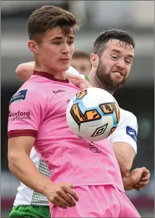  ??  ?? Striker Aaron Dobbs shields the ball from Cabinteely’s Conor Earley.