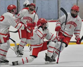  ?? CHRIS CHRISTO — BOSTON HERALD ?? Hingham celebrates its first goal against Catholic Memorial during a 3-1 boys hockey win Wednesday night in a battle of state powers.