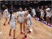  ?? JOSE CARLOS FAJARDO — STAFF PHOTOGRAPH­ER ?? Salesian's Nyana Asiasi (2) prepares to hug teammate Silivia Fonongaloa (21) after defeating Windward on Friday for the CIF State Division I championsh­ip in Sacramento.