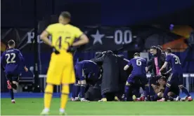  ?? Photograph: Damir Sencar/AFP/Getty Images ?? Dinamo Zagreb players and staff celebrate Mislav Orsic’s extra-time winner against Tottenham.