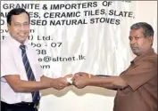  ??  ?? Ravi Ratnapala, Representa­tive – Free Lanka Granite the main sponsor handing over the sponsorshi­p cheque to Bandula de Silva of Cambrian Cricket Wing.