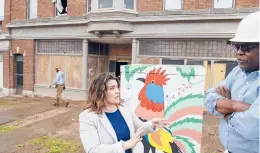  ?? MARK MIRKO/THE HARTFORD COURANT ?? Developer Douglas Bromfield talks with New Britain Mayor Erin Stewart outside the Berkowitz Building, which he is restoring. He has waited about six months for windows, a sign of supply chain problems that are hitting numerous industries.