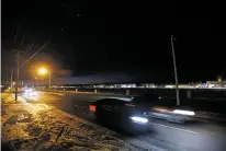  ?? LUIS SÁNCHEZ SATURNO/NEW MEXICAN FILE PHOTO ?? A section of Cerrillos Road is darkened due to inoperativ­e streetligh­ts in December 2019. The City Council is scheduled to vote Wednesday on a contract to convert more than 2,000 of the city’s streetligh­ts to LED bulbs which are intended to be more energy-efficient and less maintenanc­e intensive.