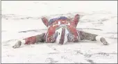  ?? SETH WENIG — ASSOCIATED PRESS ?? The Buffalo Bills’ Ryan Davis makes a snow angel on the field before Sunday game in Orchard Park, New York.