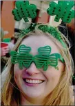  ?? ?? Esther Peresinski of Boston is dressed for the occasion as people celebrate St Patrick’s Day along Broadway in South Boston, Sunday.