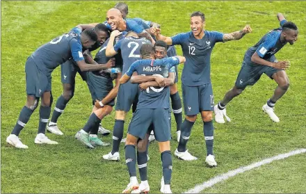  ?? AP PHOTO ?? French players celebrate at the end of the final match between France and Croatia at the 2018 soccer World Cup in the Luzhniki Stadium in Moscow, Russia, Sunday. France won 4-2.