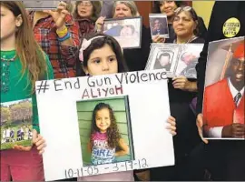  ?? Chip Somodevill­a Getty Images ?? A GIRL shares a message at a gun violence prevention rally in Washington in December 2016. Public support for gun restrictio­ns has been steadily growing.