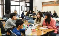  ?? NORIKO HAYASHI — THE NEW YORK TIMES ?? Wives of workers at the Taiwan Semiconduc­tor Manufactur­ing Co. plant in Kikuyo, Japan, attend a Japanese language class at a community center in the town on March 19.