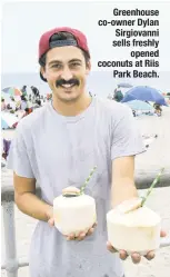  ??  ?? Greenhouse co-owner Dylan Sirgiovann­i sells freshly opened coconuts at Riis Park Beach.