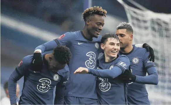  ??  ?? Chelsea’s Tammy Abraham (centre) celebrates scoring his side’s third goal of the game and hat-trick with his team-mates.