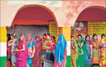  ?? AFP ?? Voters queue up to cast their votes at a polling station in Masaurhi in Bihar on Wednesday.