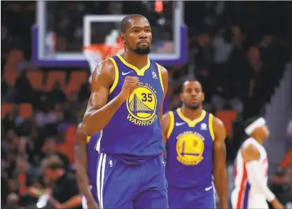  ?? GREGORY SHAMUS — GETTY IMAGES ?? Warriors superstar Kevin Durant delivered a prolific performanc­e with a season-high 36 points, 10 rebounds and seven assists in Friday’s 102-98 win over the Detroit Pistons to complete a 6-0 trip. Durant scored at will from the perimeter and protected...