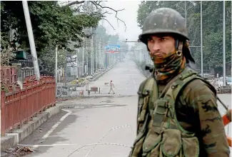  ?? AP ?? An Indian paramilita­ry soldier stands guard on a road leading towards Independen­ce Day parade venue in Srinagar.