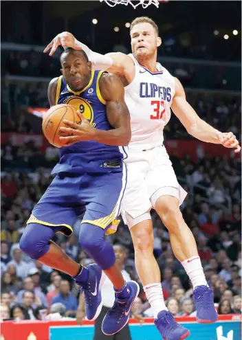  ?? AP FOTO ?? LOW CEILING. LA Clippers forward Blake Griffin, right, fouls Golden State’s forward Andre Iguodala on the way to the basket.