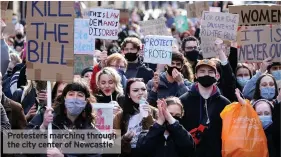  ??  ?? Protesters marching through the city center of Newcastle