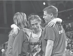  ?? PHOTOS BY PETER ACKERMAN ?? Howell’s Kylie Gudewitz, center, is shown after she won the state 114-pound championsh­ip.