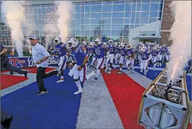  ?? Tom Morris/Louisiana Tech Sports Informatio­n ?? Taking the field: Louisiana Tech takes the field for their game against Western Kentucky last weekend in Ruston, La. On Wednesday, Louisiana Tech accepted an invitation to play in the Hawaii Bowl. The game will be played on Dec. 22 against Hawaii.
