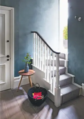  ??  ?? ENTRANCE HALL
To give this space a distinct identity, deep green Marmorino plaster was applied to the walls (above). The dark, “almost velvety” finish creates a moody atmosphere, accentuati­ng the light-filled living areas beyond. CLOAKROOM
A wall of...