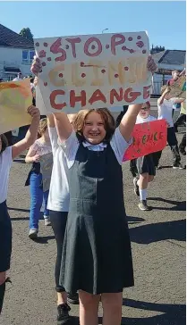  ??  ?? The children designed and made their own banners and slogans as they got the message about their climate strike across to the world’s politician­s