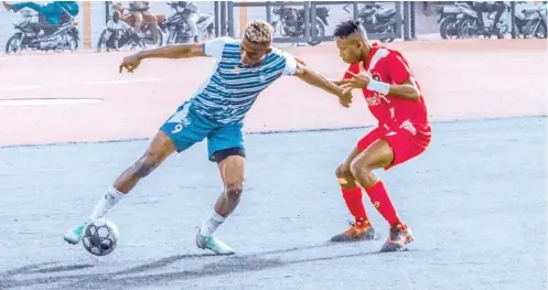  ?? ?? „ Doma United’s dangerman, Charles Chibuike (L) shields the ball from an opponent during a league match at the Pantami Stadium Gombe