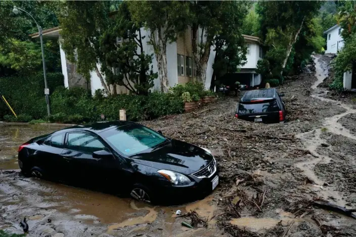  ?? Photograph: Marcio José Sánchez/AP ?? Vehicles damaged by a mudslide are seen in the Beverly Crest area of Los Angeles on Monday.