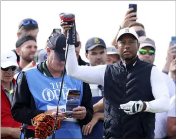  ?? AP PHOTO/PETER MORRISON ?? U.S golfer Tiger Woods prepares to tee off on the 7th hole during a practice round at the British Open golf championsh­ip on the Old Course at St. Andrews, Scotland, Monday.