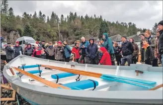  ?? ?? There was a good turnout for the launch of Nellie G, with her turquoise, grey and white colours chosen by the Appin community. The club’s chairperso­n Elaine Venters officially named the skiff with whisky donated by Oban Distillery.