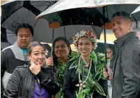  ?? STUFF, GETTY ?? Jacinda Ardern was sheltering from the weather at yesterday’s Pasifika Festival in Auckland, above, but since Cook Island PM Mark Brown met Foreign Affairs Minister Nanaia Mahuta last week, left, there has been plenty of stormy talks about bubbles. Right, Mii Hinarere Tupangaia, president of the Hutt Valley Cook Islands Associatio­n.