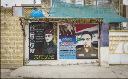  ??  ?? A mural outside the family home in Baghdad pays homage to al-Sudani.