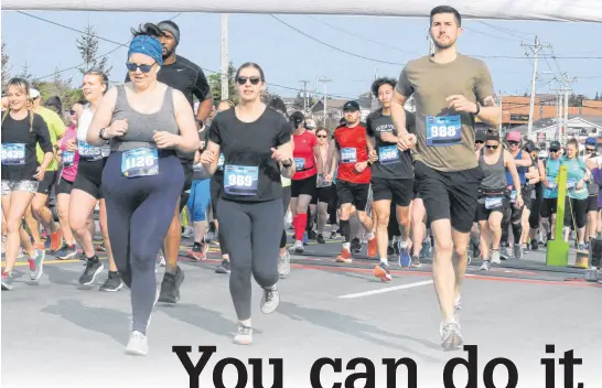  ?? JOE GIBBONS • THE TELEGRAM ?? Runners and walkers make their way along the route from the start line in Paradise along Harvey Road and on Military Road as they were heading for the home stretch to the finish line at Bannerman Park during the 95th edition of the Tely 10, 10-Mile road race on June 25.