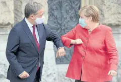  ?? REUTERS ?? Angela Merkel and Armin Laschet meet during the spread of the coronaviru­s disease in Duesseldor­f last year.