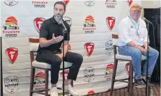  ?? MIKE CARLSON/ASSOCIATED PRESS ?? Jimmie Johnson, left, speaks about joining the team of Chip Ganassi, right, for the IndyCar Series at a press conference Saturday.