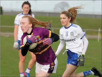  ??  ?? Wexford corner-back Grace Cloney breaking free of Monaghan’s Casey Treanor.