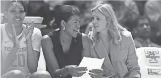  ?? SAUL YOUNG/NEWS SENTINEL ?? Tennessee women’s basketball head coach Kellie Harper, right, talks with assistant coach Joy McCorvey during a game against Georgia Stage on Dec. 12, 2021, in Knoxville.