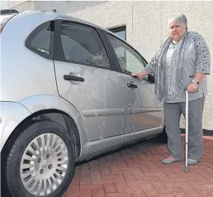  ?? Picture: Kim Cessford. ?? Mrs Jennifer Brook shows the damage her car sustained in the deliberate attack.