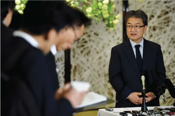  ?? (Toru Yamanaka/Reuters) ?? US SPECIAL REPRESENTA­TIVE for North Korea Policy Joseph Yun (right) answers questions following a meeting with Japan and South Korea chief nuclear negotiator­s in Tokyo earlier this year.