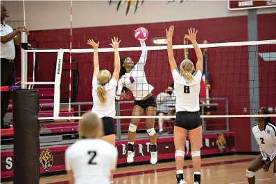  ?? Staff photo by Kelsi Brinkmeyer ?? Liberty-Eylau player Ja’Niya Sanders hits the ball over the net during the match against Pleasant Grove on Tuesday at Rader Dome.