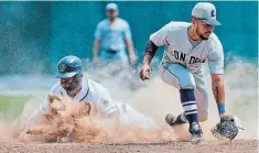  ?? BOB TYMCZYSZYN TORSTAR FILE PHOTO ?? Welland’s Vaughn Bryan slides safely into second in Intercount­y Baseball League action against London. COVID-19 cancelled the 2020 season for the eight-team league.