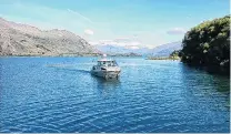  ?? PHOTOS:SUPPLIED ?? Niwa researcher­s on the water at Lake Wanaka in December 2019, using equipment to map sediments beneath the lake bed.