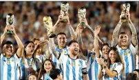  ?? ?? Lionel Messi and teammates celebrate with their families. — reuters