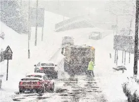  ??  ?? > Forecasts for snowy weather are worsening. It may bring travel disruption