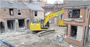  ??  ?? Curtains for the cobbles... a bulldozer tears down TV’s iconic Coronation Street